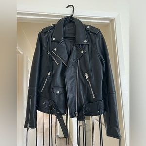 Black leather jacket with tassels